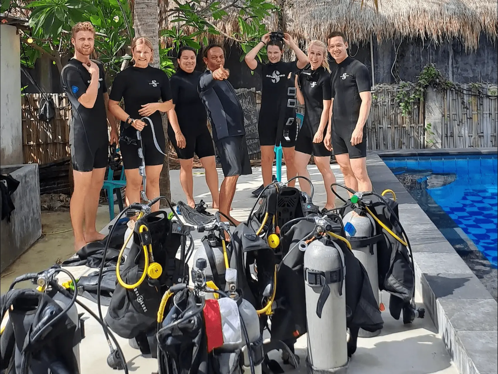 Group of Scuba Divers after their dives with their instructor